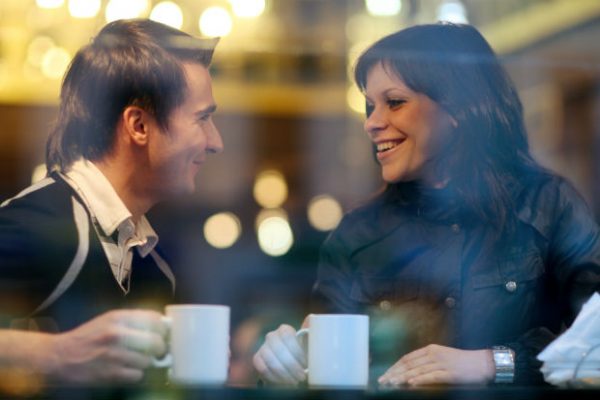 Couple talking over coffee