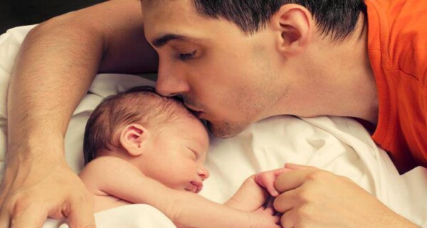 Loving-father-kissing-baby