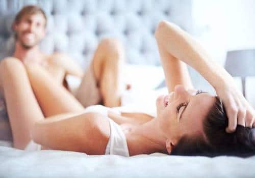 couple-laughing-in-bed