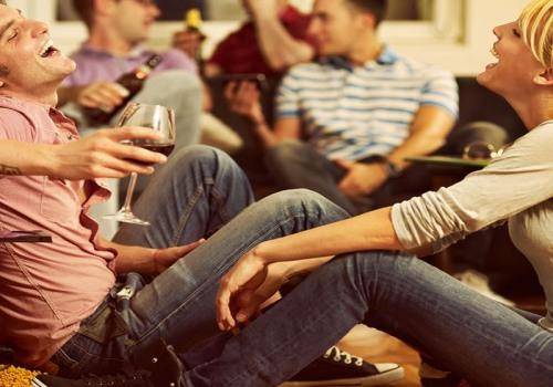 couple sitting on the floor laughing