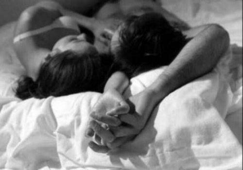 happy couple on bed