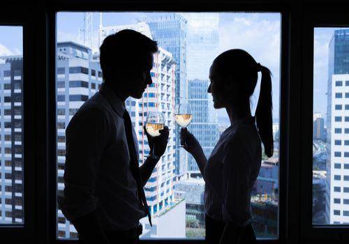 man and woman at work place