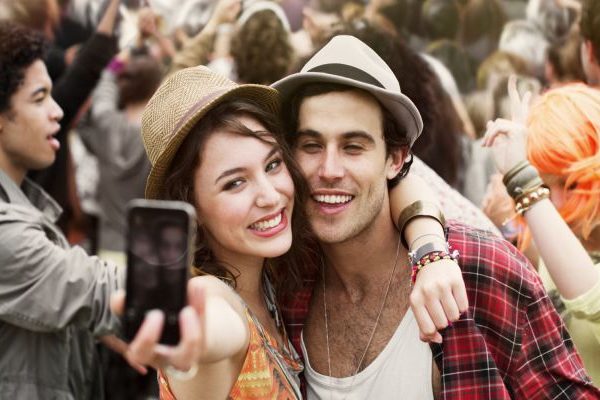 man and woman clicking selfie