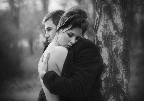 man hugging woman