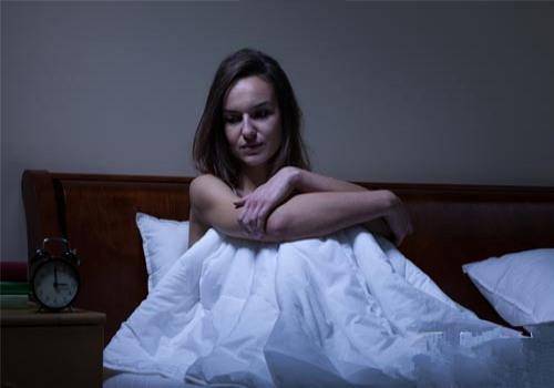 sad lady in bed