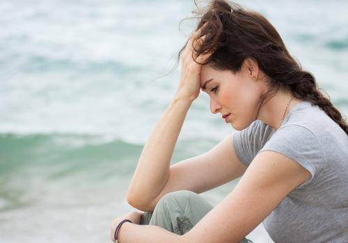 sad lady on the beach