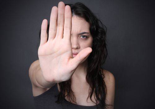 woman showing stop sign