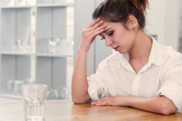 An upset woman sitting alone