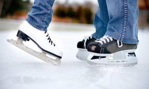 couple foot doing ice skating