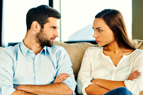couple seeing each other while sitting on couch