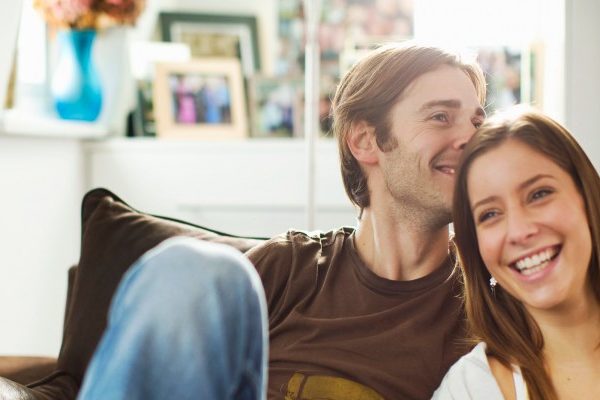 happy couple chilled out in home