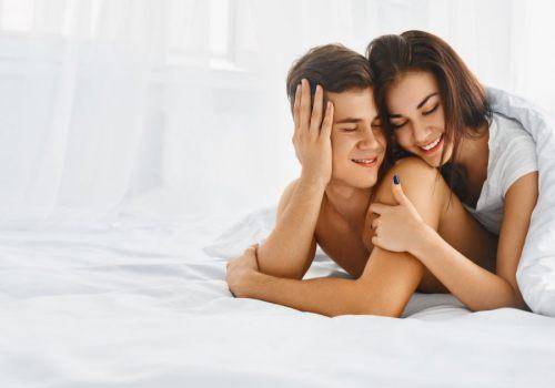 happy-couple-hugging-in-bed