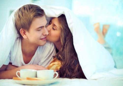 lady kissing man on cheek