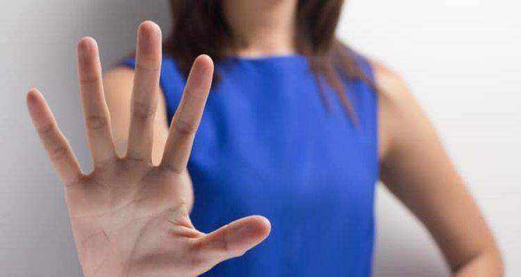 lady-showing-stop-sign-for-abuse