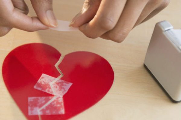 lady stiching broken heart