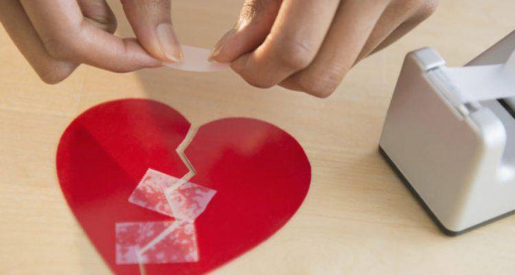 lady stiching broken heart