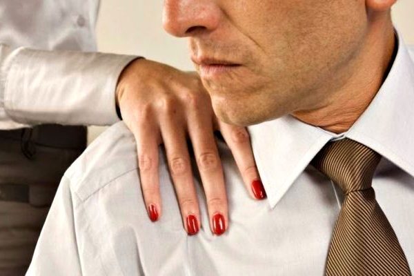lady touching man in the office