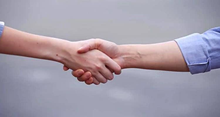 Man and woman shaking hands