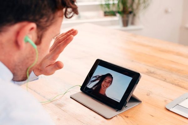 man talking to girl via video call