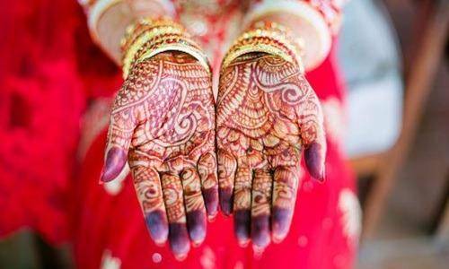 mehendi in the hand of new bride