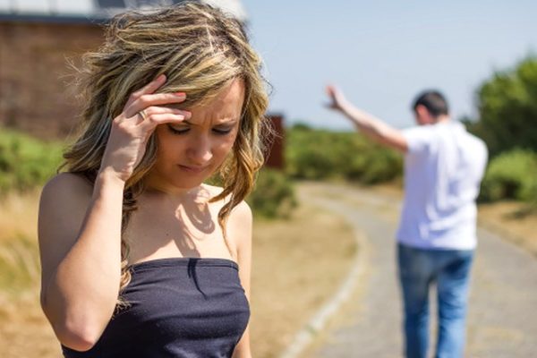 sad lady going far away from the man
