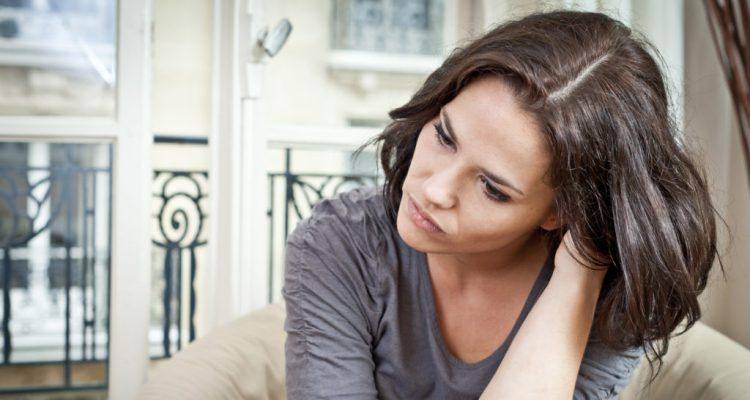 sad-lady-thinking-at-home