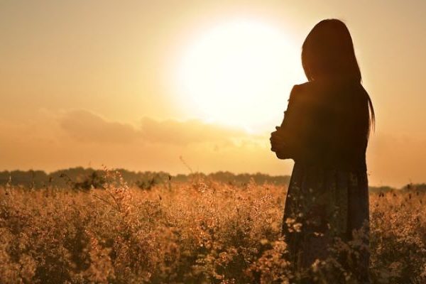 sad woman seeing sunset