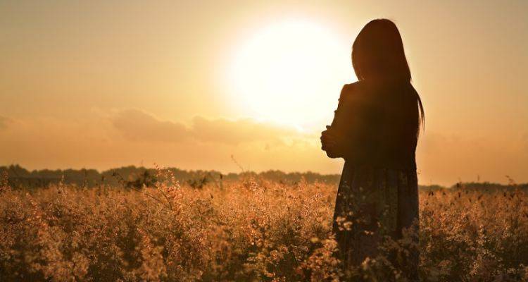 sad woman seeing sunset