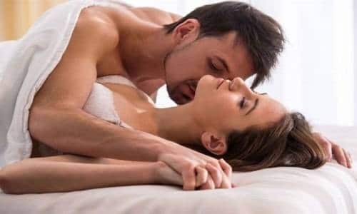 sexy couple in bed with white bedsheet