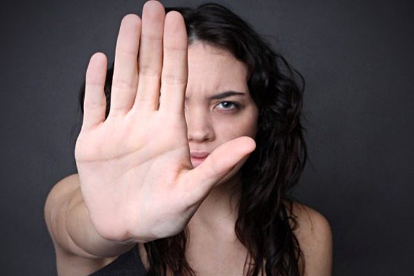 woman showing stop sign