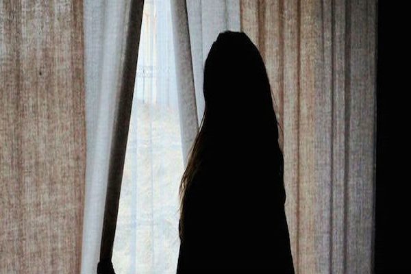 Woman-Opening-Curtains