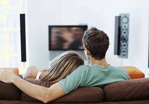couples intimate watching tv