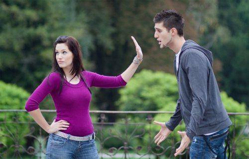 lady pushing man away