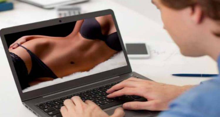 Man watching sexy lady on laptop