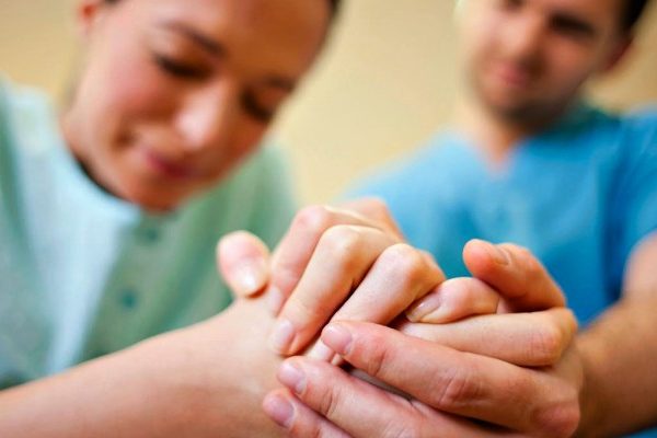 man and woman folding hands
