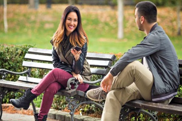 man and woman talking