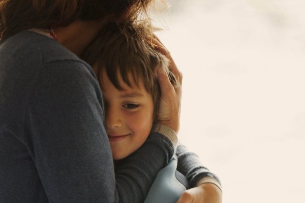 mother hugging child