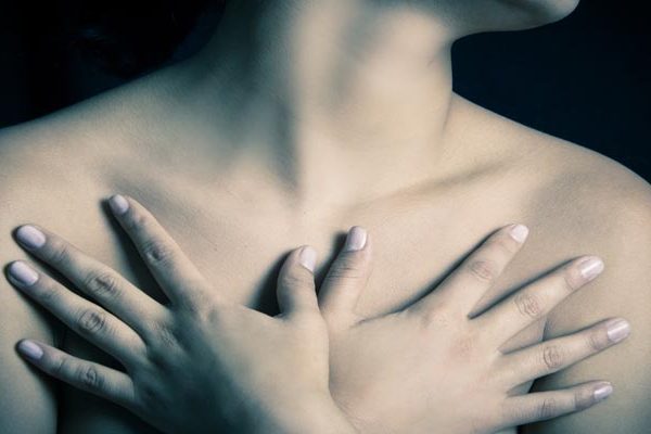 woman covering her chest