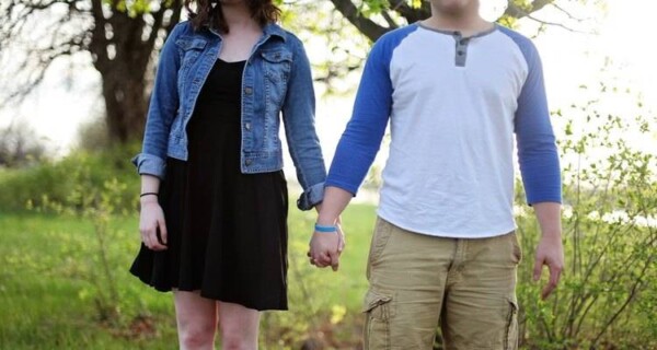 young couple holding hands