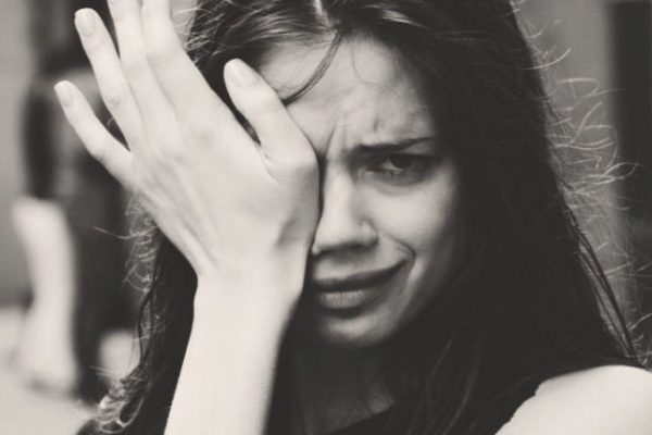 Black and white close up of woman crying