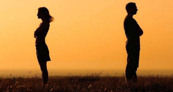 Silhouette-of-a-man-and-woman-facing-away-from-each-other-