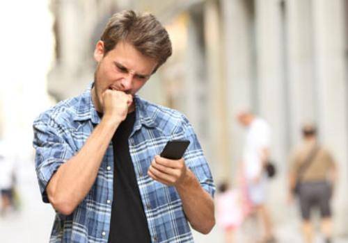 angry man seeing phone