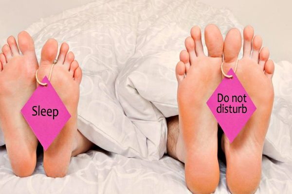asexual couple in bed