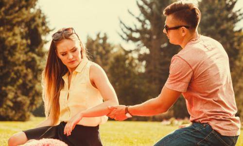 couple in garden and woman not talking