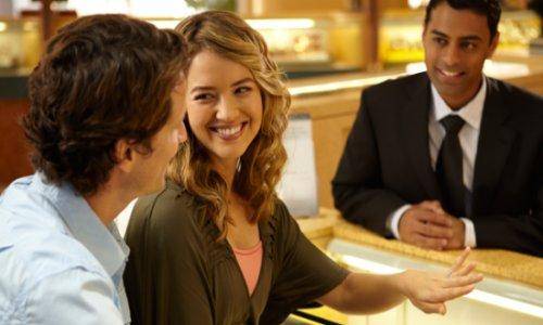 couple purchasing diamond ring