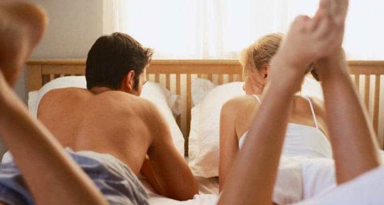 couple in bed talking