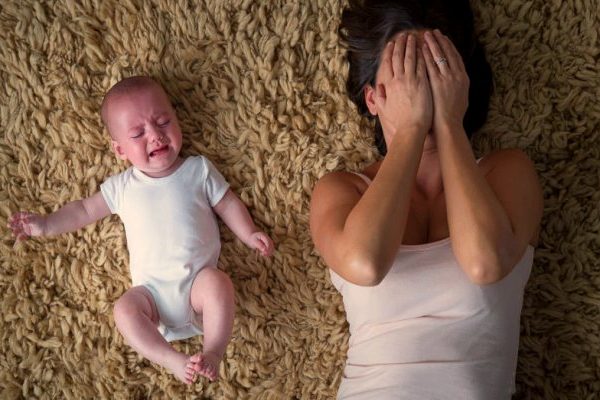 crying woman with child