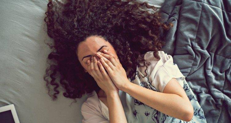 lady crying in bed