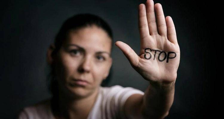lady showing stop signal by hand