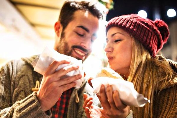 man and woman eating